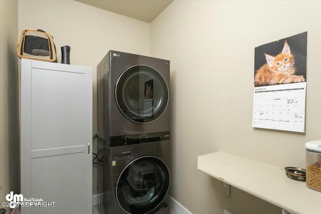 washroom with laundry area and stacked washer / dryer