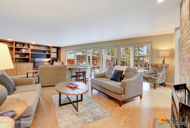 living room featuring a wealth of natural light, light wood-style flooring, and recessed lighting