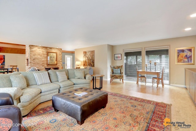 living room with recessed lighting, baseboards, and light wood finished floors