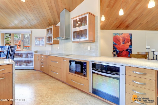 kitchen featuring ventilation hood, built in microwave, stainless steel oven, black electric stovetop, and tasteful backsplash