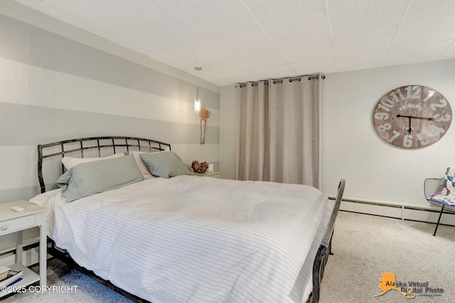 bedroom featuring a baseboard heating unit