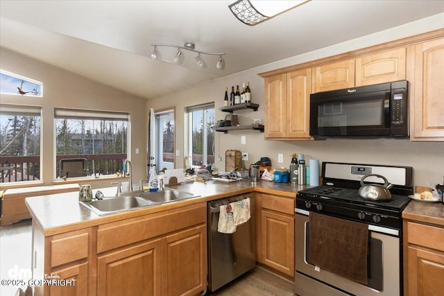 kitchen with a sink, open shelves, appliances with stainless steel finishes, a peninsula, and vaulted ceiling