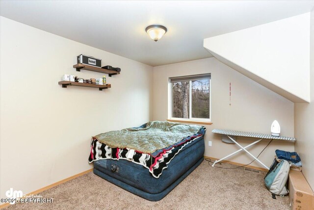 carpeted bedroom with baseboards