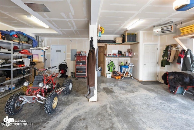 garage with electric panel and a garage door opener