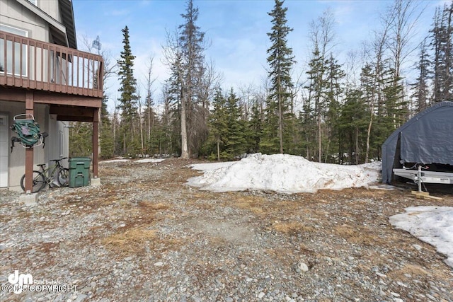 view of yard featuring a wooden deck