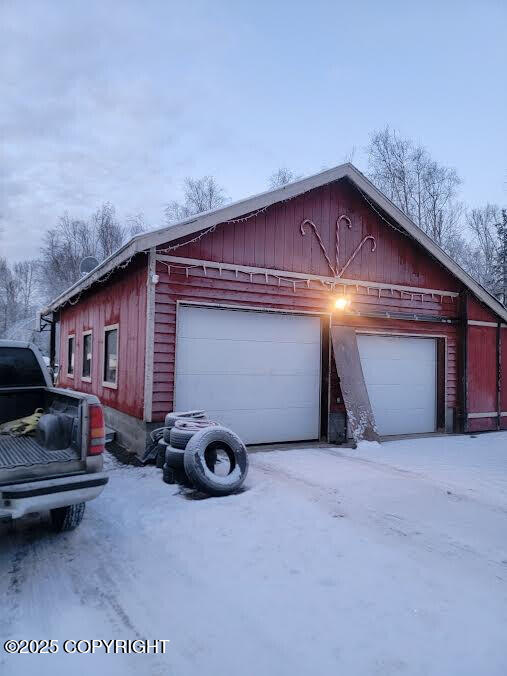 view of side of home with a garage