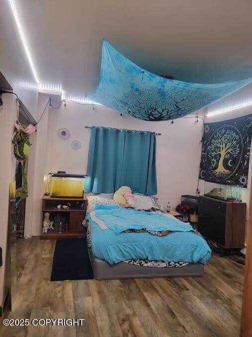 bedroom featuring wood finished floors