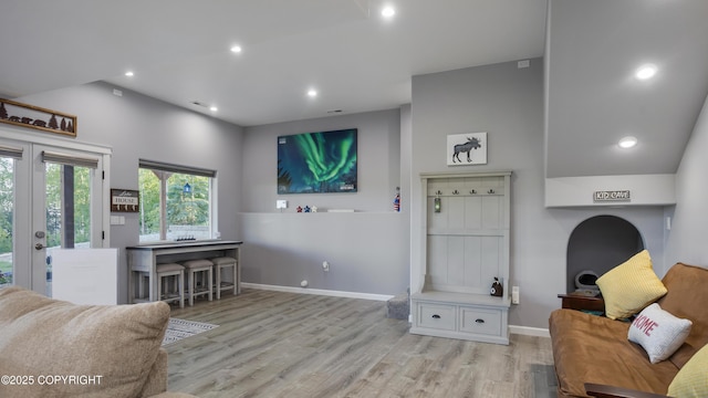 interior space featuring recessed lighting, french doors, baseboards, and wood finished floors