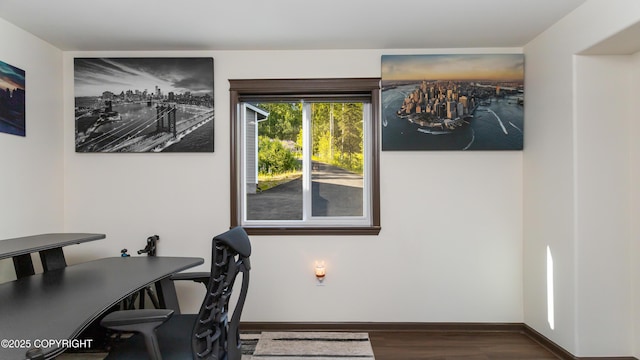 home office with wood finished floors and baseboards