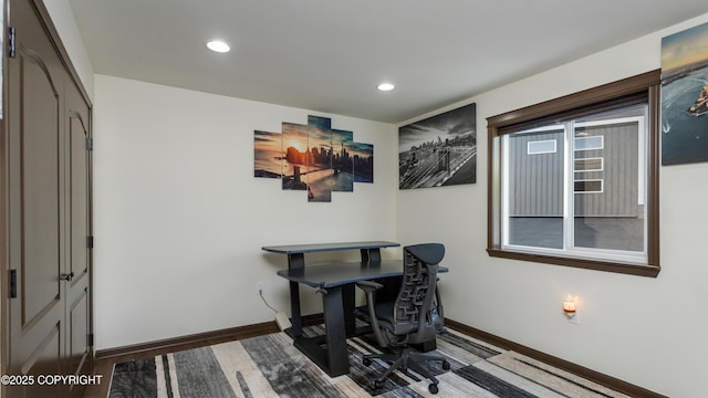 office featuring recessed lighting, baseboards, and wood finished floors