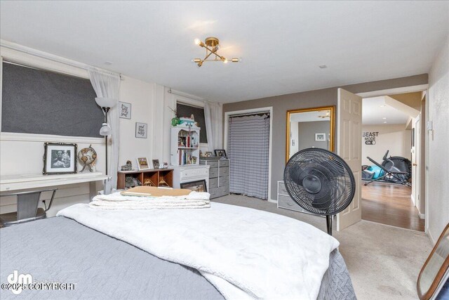 carpeted bedroom with a fireplace