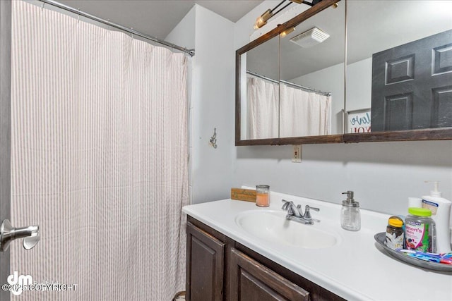 full bathroom with vanity and visible vents