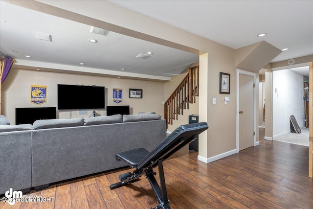 living room featuring baseboards, visible vents, recessed lighting, stairs, and hardwood / wood-style flooring