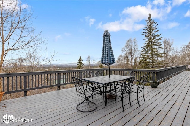 wooden deck featuring outdoor dining space