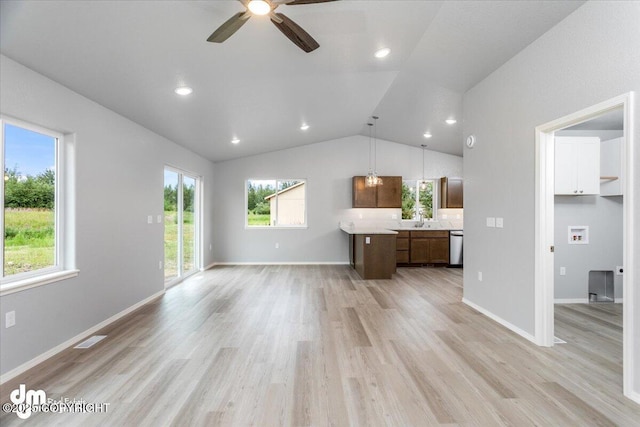 unfurnished living room featuring light wood-type flooring, visible vents, lofted ceiling, and baseboards