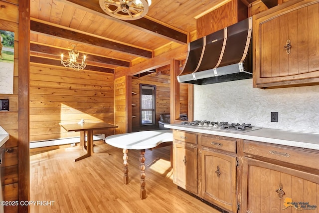 kitchen featuring wooden ceiling, wall chimney range hood, white gas cooktop, and light wood-type flooring