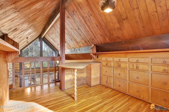 interior space featuring beamed ceiling, high vaulted ceiling, wood finished floors, wooden walls, and wooden ceiling