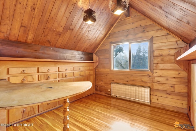 bonus room with wooden ceiling, lofted ceiling, wood finished floors, and radiator heating unit