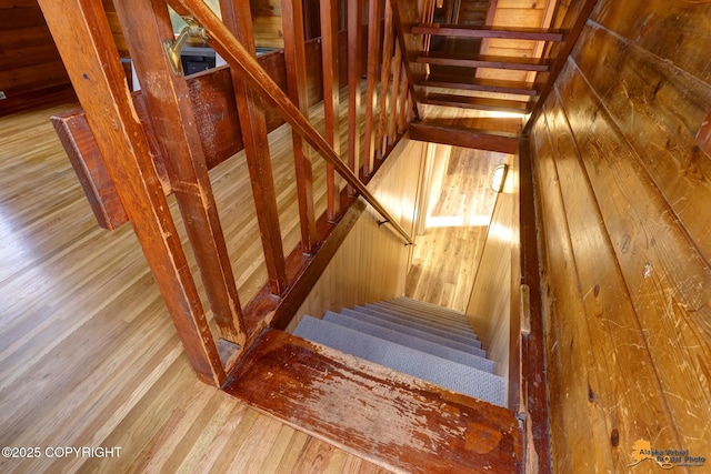 stairway with wood finished floors