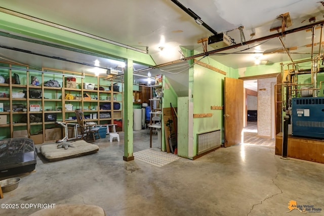 basement with a heating unit and a garage