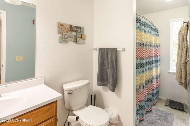 bathroom with a shower with shower curtain, toilet, and vanity