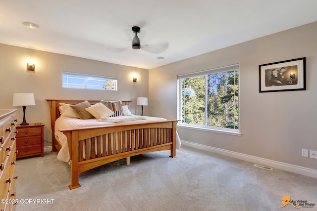 bedroom featuring visible vents, ceiling fan, baseboards, and carpet floors