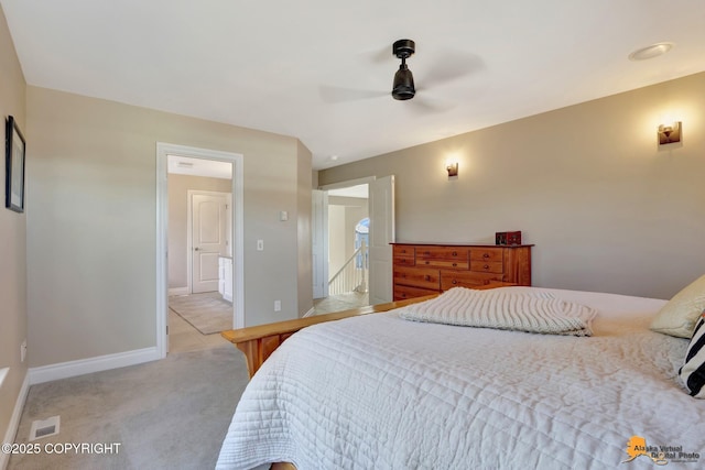 bedroom featuring visible vents, baseboards, light colored carpet, and a ceiling fan