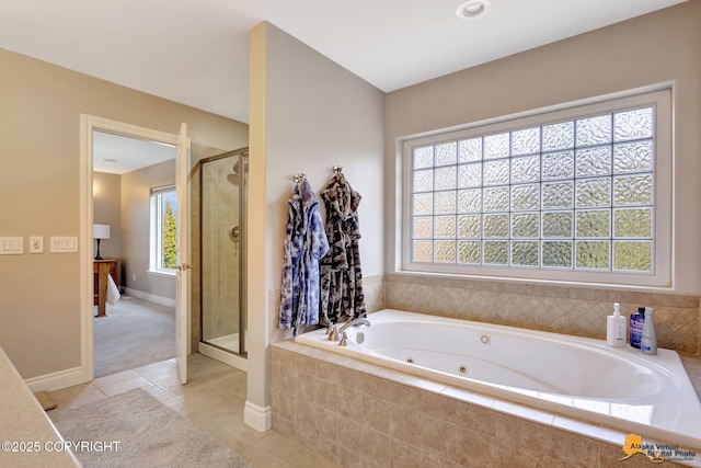 full bathroom with tile patterned floors, a healthy amount of sunlight, and a stall shower