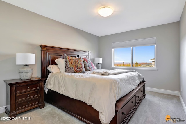 bedroom featuring light carpet and baseboards