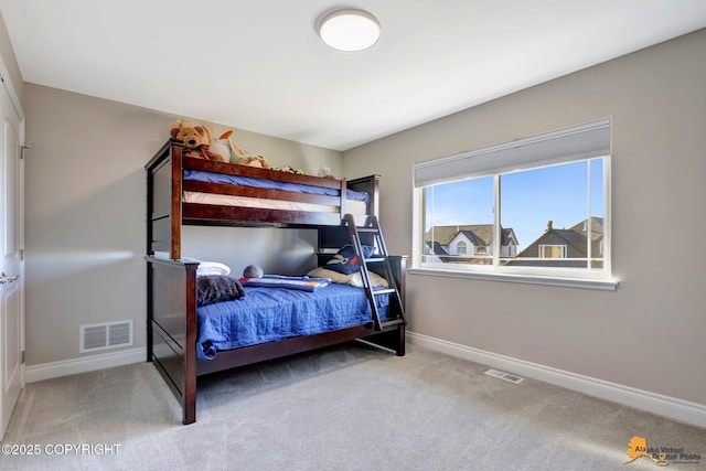 bedroom with visible vents, carpet flooring, and baseboards