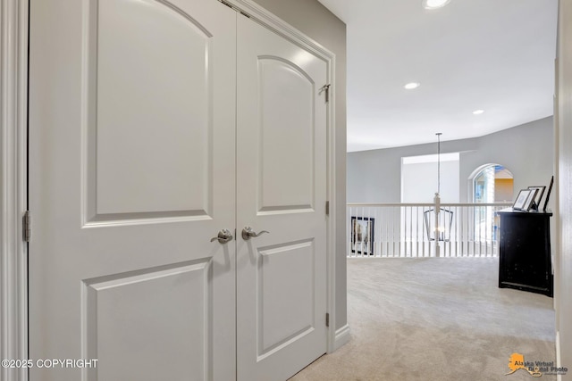 hall featuring recessed lighting and carpet floors