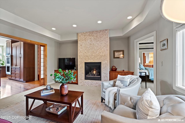 1665 Bob Atwood Cir, Anchorage, AK 99517 - living room with a tiled fireplace, a wealth of natural light, and recessed lighting