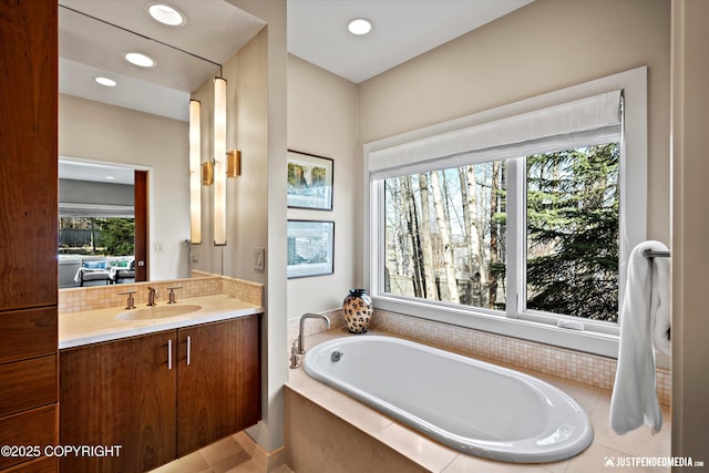 1665 Bob Atwood Cir, Anchorage, AK 99517 - bathroom featuring recessed lighting, backsplash, vanity, and a garden tub