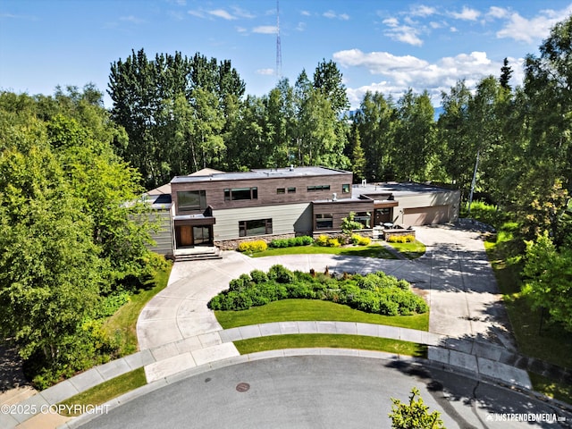 1665 Bob Atwood Cir, Anchorage, AK 99517 - view of front of property featuring curved driveway and stone siding