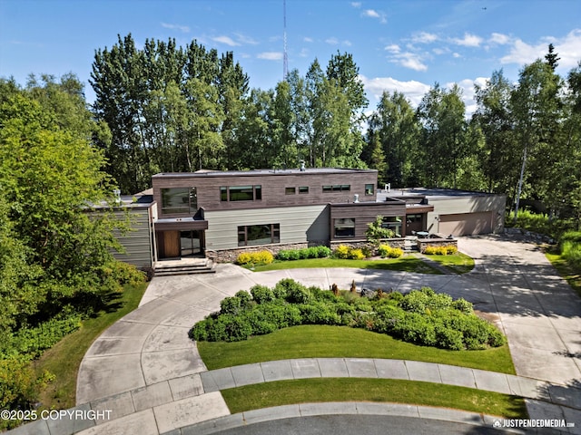1665 Bob Atwood Cir, Anchorage, AK 99517 - view of front facade with curved driveway and stone siding