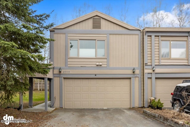 view of front of property with a garage and driveway