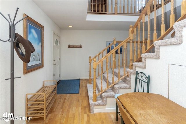 entrance foyer featuring baseboards and wood finished floors