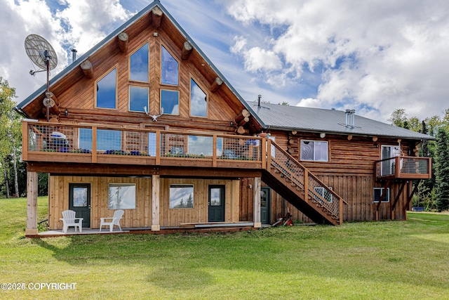 back of house with a patio, stairway, log exterior, and a yard