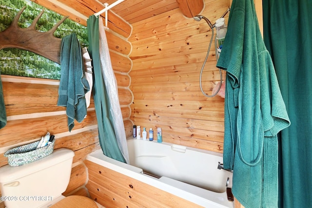 bathroom featuring toilet, wood ceiling, shower / bath combo, and log walls