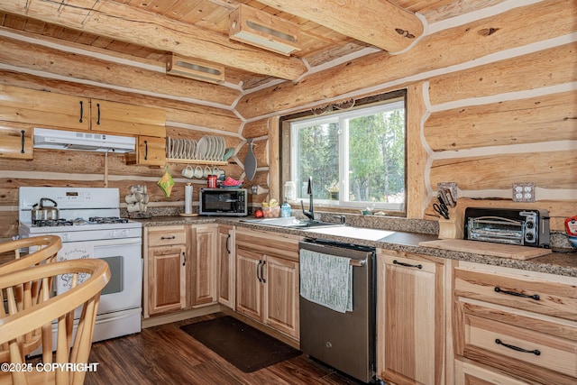 kitchen featuring beamed ceiling, under cabinet range hood, a sink, appliances with stainless steel finishes, and dark wood-style flooring