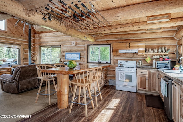 kitchen featuring beamed ceiling, dark wood-type flooring, under cabinet range hood, stainless steel dishwasher, and white gas range oven