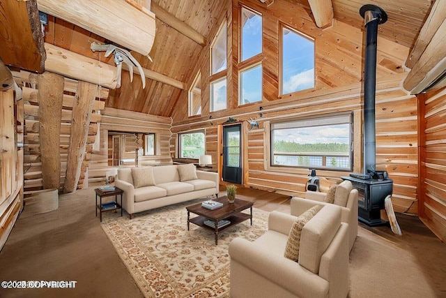 living area with a wood stove, wood ceiling, beamed ceiling, and high vaulted ceiling