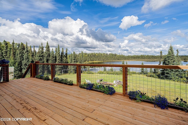 deck featuring a lawn and a water view