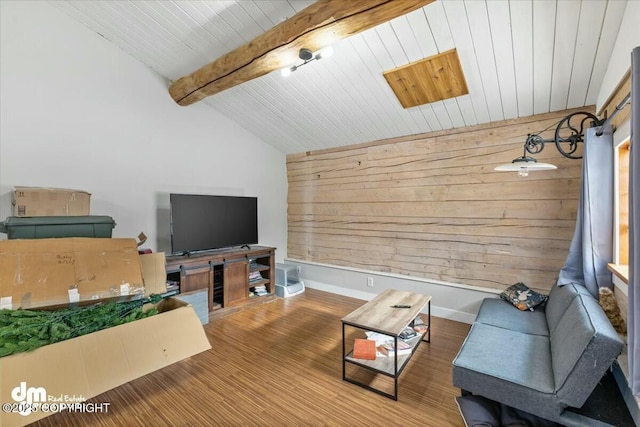 living area with lofted ceiling with beams, wooden walls, wood finished floors, and wooden ceiling