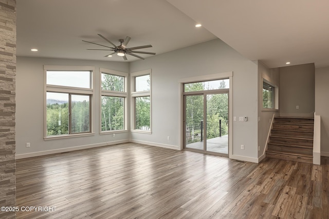9475 E Spring Creek Cir, Wasilla, AK 99654 - unfurnished living room featuring ceiling fan, wood finished floors, stairs, baseboards, and recessed lighting