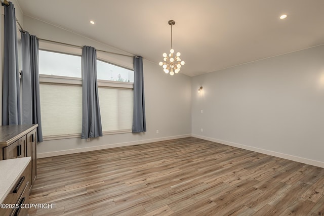 9475 E Spring Creek Cir, Wasilla, AK 99654 - unfurnished room with baseboards, a chandelier, light wood-style floors, and recessed lighting