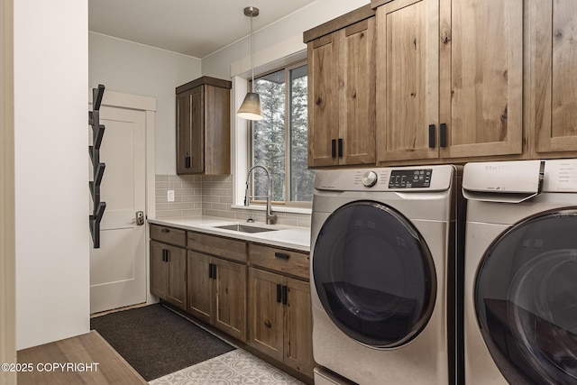 9475 E Spring Creek Cir, Wasilla, AK 99654 - laundry area featuring washer and clothes dryer and cabinet space