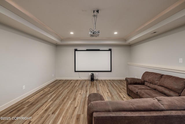 9475 E Spring Creek Cir, Wasilla, AK 99654 - home theater featuring a tray ceiling, baseboards, wood finished floors, crown molding, and recessed lighting