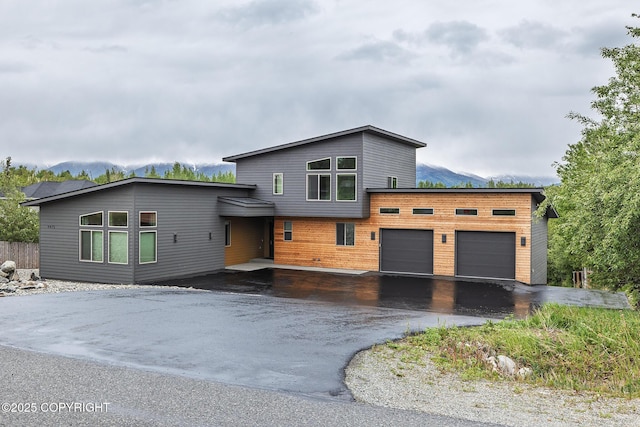 9475 E Spring Creek Cir, Wasilla, AK 99654 - contemporary home featuring asphalt driveway and a garage