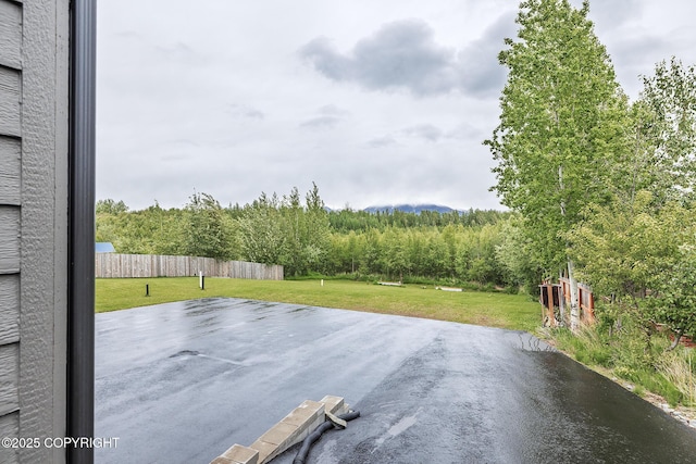 9475 E Spring Creek Cir, Wasilla, AK 99654 - view of patio / terrace featuring a wooded view